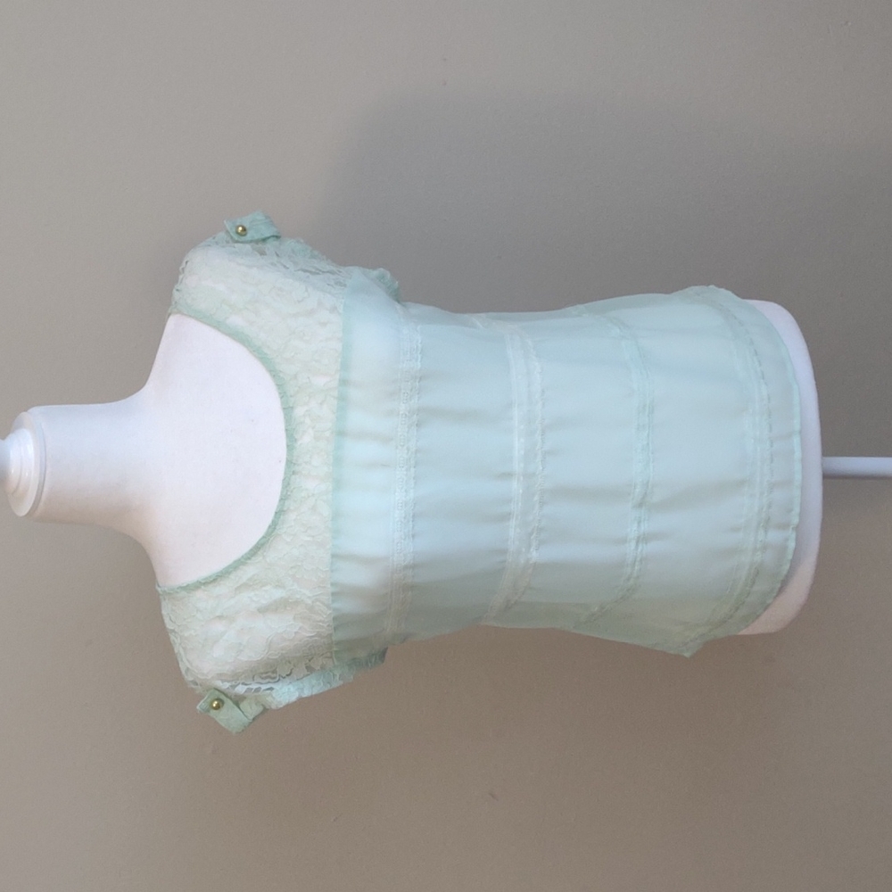 Candie's pastel green cap-sleeve sheer‎ top with lace detail. Size M